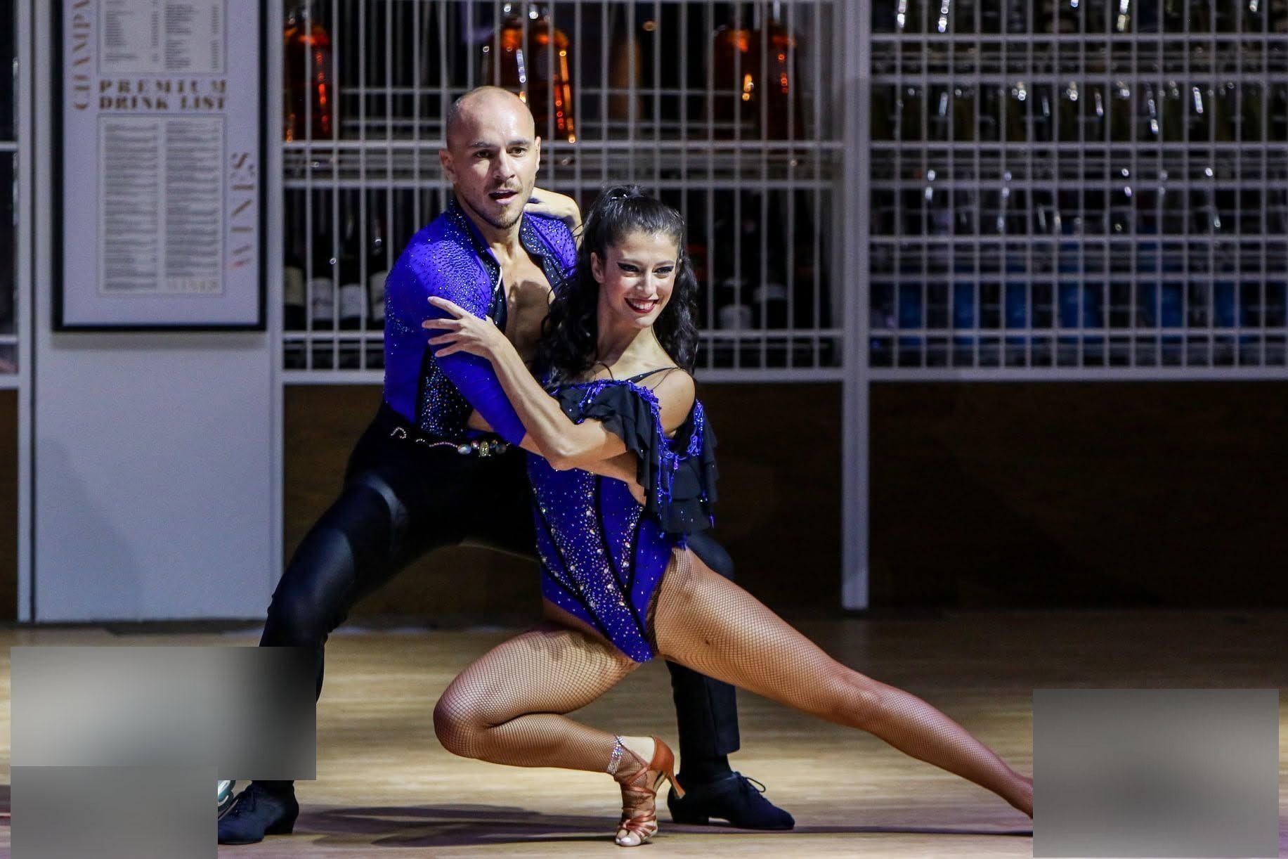 George and Elena dancing salsa in a show